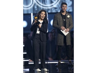 Alessia Cara accepts the award for best new artist from Nick Jonas at the 60th annual Grammy Awards at Madison Square Garden on Sunday, Jan. 28, 2018, in New York. (Matt Sayles/Invision/AP)