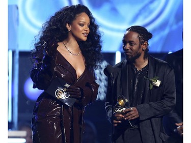 Rihanna, left, and Kendrick Lamar accept the award for best rap/sung performance for "Loyalty" at the 60th annual Grammy Awards at Madison Square Garden on Sunday, Jan. 28, 2018, in New York. (Matt Sayles/Invision/AP)