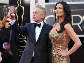 Actors Michael Douglas, left, and Catherine Zeta-Jones arrive at the Oscars at the Dolby Theatre on Sunday Feb. 24, 2013, in Los Angeles.
