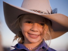 This photo taken in 2009 and provided by Akubra Hats, shows Amy "Dolly" Everett in Brunette Downs in the Northern Territory, Australia. Hundreds of people are remembering Dolly who was known as the angelic face of the Australian bushmen's hat brand and whose family says she killed herself after being targeted by cyberbullying. A memorial service for Dolly was held in the tiny Northern Territory town of Katherine on Friday, Jan. 12, 2018 near her family's cattle ranch. (Akubra Hats via AP)