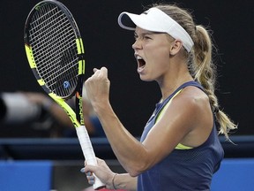 Denmark's Caroline Wozniacki reacts while playing Romania's Simona Halep during the women's singles final at the Australian Open tennis championships in Melbourne, Australia, Saturday, Jan. 27, 2018.