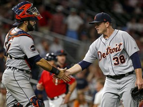 In this July 21, 2017, file photo, Detroit Tigers catcher Alex Avila and relief pitcher Justin Wilson celebrate a win over the Minnesota Twins. (AP Photo/Bruce Kluckhohn, File)