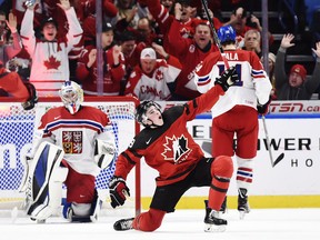 Canada forward Drake Batherson celebrates his goal against Czech Republic goaltender Josef Korenar on Jan. 4, 2018