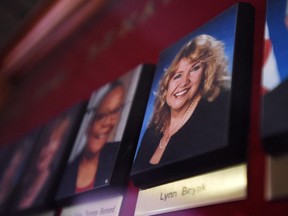 A picture of Senator Lynn Beyak accompanies other Senators' official portraits on a display outside the Senate on Parliament Hill in Ottawa on Thursday, Sept. 21, 2017.