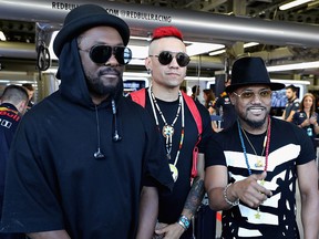 The Black Eyed Peas (l-r) will.i.am, Taboo and apl.de.ap pose for a photo outside the Red Bull Racing garage before qualifying for the Azerbaijan Formula One Grand Prix at Baku City Circuit on June 24, 2017 in Baku, Azerbaijan.  (Mark Thompson/Getty Images)