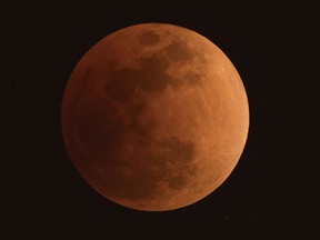 The moon is seen during a lunar eclipse, referred to as the "super blue blood moon,", in Beijing on Jan. 31, 2018. (NICOLAS ASFOURI/AFP/Getty Images)