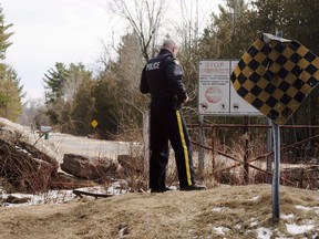 An RCMP officer keeps watch for illegal aliens at the border from New York into Canada, Monday, March 6, 2017 in Hemmingford, Quebec.