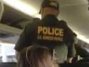In this Friday, Jan. 19, 2018, image made from video, a Border Patrol officer requests identification of travelers on a Greyhound bus in Fort Lauderdale, Fla.
