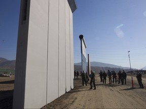 Ronald Vitiello, U.S. Customs and Border Protections acting deputy commissioner, tours the construction site where several prototypes of a border wall were constructed in San Diego on Oct. 26, 2017.