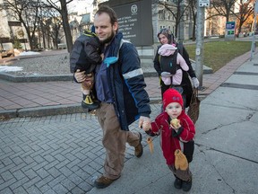 Joshua Boyle, his wife, Caitlan Boyle and their three children, Jonah, Noah and Grace are seen strolling up Elgin St. past the courthouse in downtown Ottawa on Nov. 22, 2017.