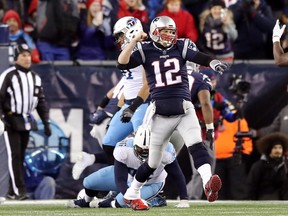 Tom Brady of the New England Patriots reacts after a touchdown in the third quarter of the AFC Divisional Playoff game against the Tennessee Titans at Gillette Stadium on January 13, 2018 in Foxborough, Massachusetts. (Elsa/Getty Images)