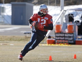 New England Patriots quarterback Tom Brady runs with the ball during an NFL football practice, Thursday, Jan. 25, 2018, in Foxborough, Mass. (AP Photo/Steven Senne)
