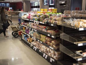Newly released court documents related to an alleged industry-wide bread-price fixing case show the Competition Bureau believes at least seven companies, including Canada's three major grocers, committed indictable offences under the Competition Act. Various brands of bread sit on shelves in a grocery store in Toronto on Wednesday Nov. 1, 2017.