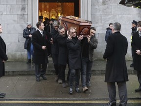 The coffin of Cranberries singer Dolores O'Riordan is removed from St Joseph's Church in Limerick, Ireland, Sunday, Jan. 21, 2018. O'Riordan, 46, was found dead Monday morning at a London hotel.