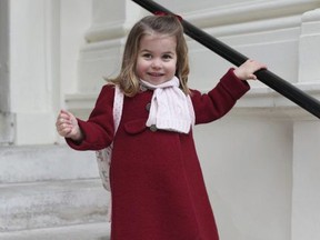 In this handout picture provided by the Duke and Duchess of Cambridge, Britain's Princess Charlotte smiles as she prepares for her first day of nursery at the Willcocks Nursery School, in London, Monday, Jan. 8, 2018.