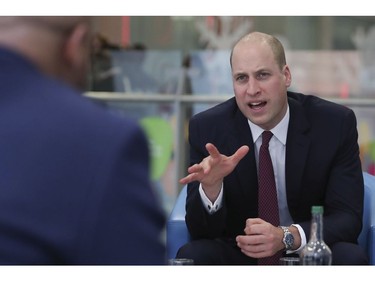 Britain's Prince William,  speaks with military veterans now working for the National Health Service as he visits Evelina London Children's Hospital in London on Thursday Jan. 18, 2018, to launch a nationwide programme to help veterans find work in the NHS.