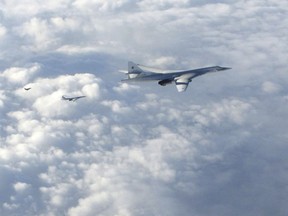 In this image made available by the Royal Air Force Monday, Jan. 15, 2018, two Russian Blackjack Tupolev Tu-160 long-range bombers are followed by an RAF Typhoon aircraft, left, scrambled from RAF Lossiemouth, Scotland.
