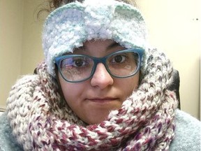 In this Thursday, Jan. 4, 2018, selfie photo provided by Rebecca Miller, Miller, an academic adviser at Tennessee State University, wears sweaters, a scarf, ear coverings, gloves and a blanket over her lap while she works at her desk in Holland Hall on campus in Nashville, Tenn. Many office workers find they still have to brave the cold even after they escape the frigid outdoors during the extremely cold winter weather.