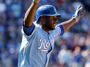 Kansas City Royals' Lorenzo Cain celebrates after hitting an RBI single during the ninth inning to win a baseball game against the Texas Rangers on July 16, 2017