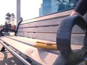 In this screenshot, a woman leaves a 'lost' wallet on a bench as part of an Atlantic Credit Unions marketing campaign.