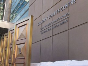 The sign at the Calgary Courts Centre in Calgary is shown on Friday, Jan. 5, 2018. former longtime employee of the Young Canadians performance group begins a trial today on 22 child sex abuse charges.