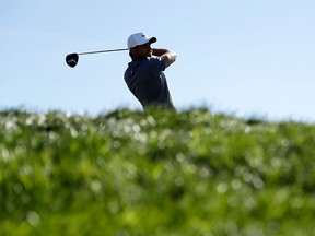 Jason Day, of Australia, watches his tee shot on the 12th hole of the South Course at Torrey Pines Golf Course during the final round of the Farmers Insurance Open golf tournament, Sunday, Jan. 28, 2018, in San Diego. (AP Photo/Gregory Bull)