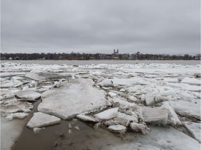 Accumulated ice floats on the Rivière des Prairies looking north toward Laval.