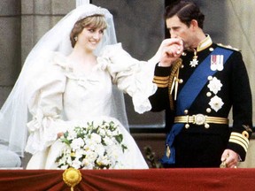 This file picture taken July 29, 1981, shows Prince Charles and Diana, the Princess of Wales, on the balcony of Buckingham Palace on their wedding day.  (AFP/Getty Images)