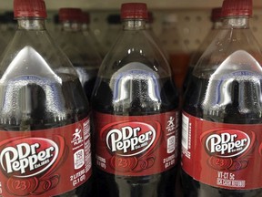 This April 28, 2016, file photo shows bottles of Dr. Pepper on a store shelf at Quality Cash Market in Concord, N.H.