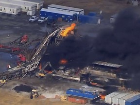 In this photo provided from a frame grab from Tulsa's KOTV/NewsOn6.com, fires burn at an eastern Oklahoma drilling rig near Quinton, Okla., Monday Jan. 22, 2018.