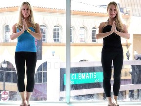 In this Oct. 12, 2011 photo, Anastasia, left, and Alexandria Duval, known as Alison and Ann Dadow before they changed their names, stand in the window of their yoga studio in West Palm Beach, Fla. (Thomas Cordy/The Palm Beach Post via AP)