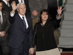 U.S. Vice President Mike Pence and his wife Karen wave as they landed at Tel Aviv airport Sunday, Jan. 21, 2018. Pence will pay a three day visit to Israel.