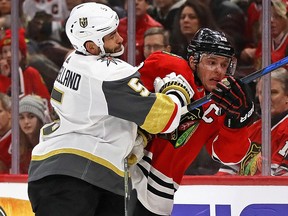 Deryk Engelland of the Vegas Golden Knights checks Jonathan Toews of the Chicago Blackhawks during a game at the United Center on January 5, 2018 in Chicago.