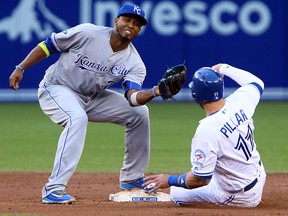 Kevin Pillar of the Blue Jays gets caught stealing against Alcides Escobar of the Kansas City Royals during MLB action at the Rogers Centre in Toronto on Tuesday July 5, 2016. (Dave Abel/Postmedia Network)