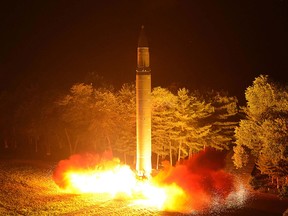 This picture released from North Korea's official Korean Central News Agency (KCNA) on July 29, 2017 and taken on July 28, 2017 shows North Korea's intercontinental ballistic missile (ICBM), Hwasong-14, being lauched at an undisclosed place in North Korea. (AFP PHOTO/KCNA VIA KNS)