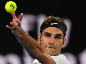 Roger Federer serves to Chung Hyeon during their men's singles semi-finals match at the Australian Open on Jan. 26, 2018