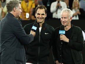 Will Ferrell and John McEnroe interview Roger Federer after Federer won his first round match against Aljaz Bedene of Slovenia on day two of the Australian Open at Melbourne Park on Jan. 16, 2018