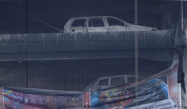 Burnt out cars after a fire at a multi-storey car park on Liverpool's waterfront, north west England, Monday Jan. 1, 2018.  (Peter Byrne/PA via AP)