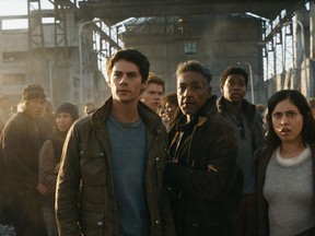FILE - This undated image released by Twentieth Century Fox shows, foreground from left, Dylan O'Brien, Giancarlo Esposito and Rosa Salazar in a scene from "Maze Runner: The Death Cure." "Maze Runner: The Death Cure" is the highest grossing film of the weekend, but according to studio estimates Sunday, Jan. 28, 2018, many moviegoers also chose the first weekend after Oscar nominations to catch up with some awards contenders like "The Shape of Water, " which got a 161 percent boost in its ninth weekend in theaters. (Twentieth Century Fox via AP, File)