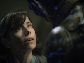 This image released by Fox Searchlight Pictures shows Sally Hawkins, left, and Doug Jones in a scene from the film "The Shape of Water." The Cold War-era merman movie was shot in Hamilton and Toronto and has a lot of homegrown behind-the-scenes talent, including Toronto digital studio Mr. X, which created the awe-inspiring visual effects.