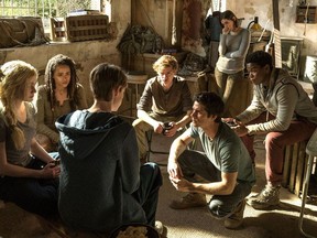 This image released by Twentieth Century Fox shows, from left, Katherine McNamara, Nathalie Emmanuel, Jacob Lofland, Thomas Brodie-Sangster, Dylan O'Brien, Rosa Salazar and Dexter Darden in a scene from "Maze Runner: The Death Cure."