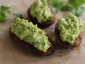 This Nov. 30, 2015 photo shows guacamole and roasted potato skins in Concord, NH. For this easy Super Bowl snack, we combined two of our favorite game day indulgences, guacamole and roasted potato skins.  (AP Photo/Matthew Mead)