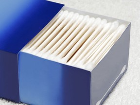 This stock photo shows an open box of cotton swabs.