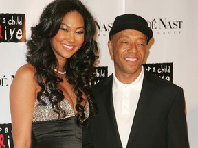 Designer Kimora Lee Simmons and Recording executive/producer Russell Simmons attend 'The Black Ball' presented by Conde Nast Media Group and hosted by Alicia Keys and Iman to benefit 'Keep A Child Alive' at Hammerstein Ballroom November 9, 2006 in New York City. (Photo by Peter Kramer/Getty Images)