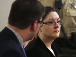 In this Dec. 14, 2017, file photo, Nicole Finn looks across the courtroom as officers come to take her away after being found guilty on kidnapping and murder charges in the starvation death of 16-year-old daughter Natalie Finn at the Polk County Courthouse in Des Moines, Iowa.