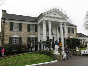 This March 13, 2017 photo shows visitors getting ready to tour Graceland in Memphis, Tenn.  (AP Photo/Beth J. Harpaz)