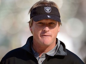 Jon Gruden looks on during pre-game warm ups before an NFL football game on Nov. 18, 2012