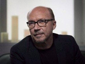 Director Paul Haggis poses in Toronto during the 2014 Toronto International Film Festival on September 6, 2014.Haggis has resigned as chair of the board of his non-profit organization Artists for Artists for Peace and Justice after four women accused him of sexual misconduct.