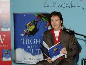 Paul McCartney reads to children from Princes Plain Primary School as he launches his first children's book "High In The Clouds" at Waterstone's, Piccadilly on Dec. 14, 2005 in London, England.  (Gareth Cattermole/Getty Images)