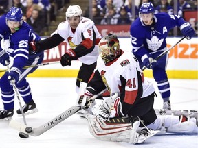 Senators goaltender Craig Anderson clears the puck from the front of the net as during the Jan. 10 game against the Leafs in Toronto. Days later, Anderson was teaching his son, Jake, to ride a bike at the family home in Florida.